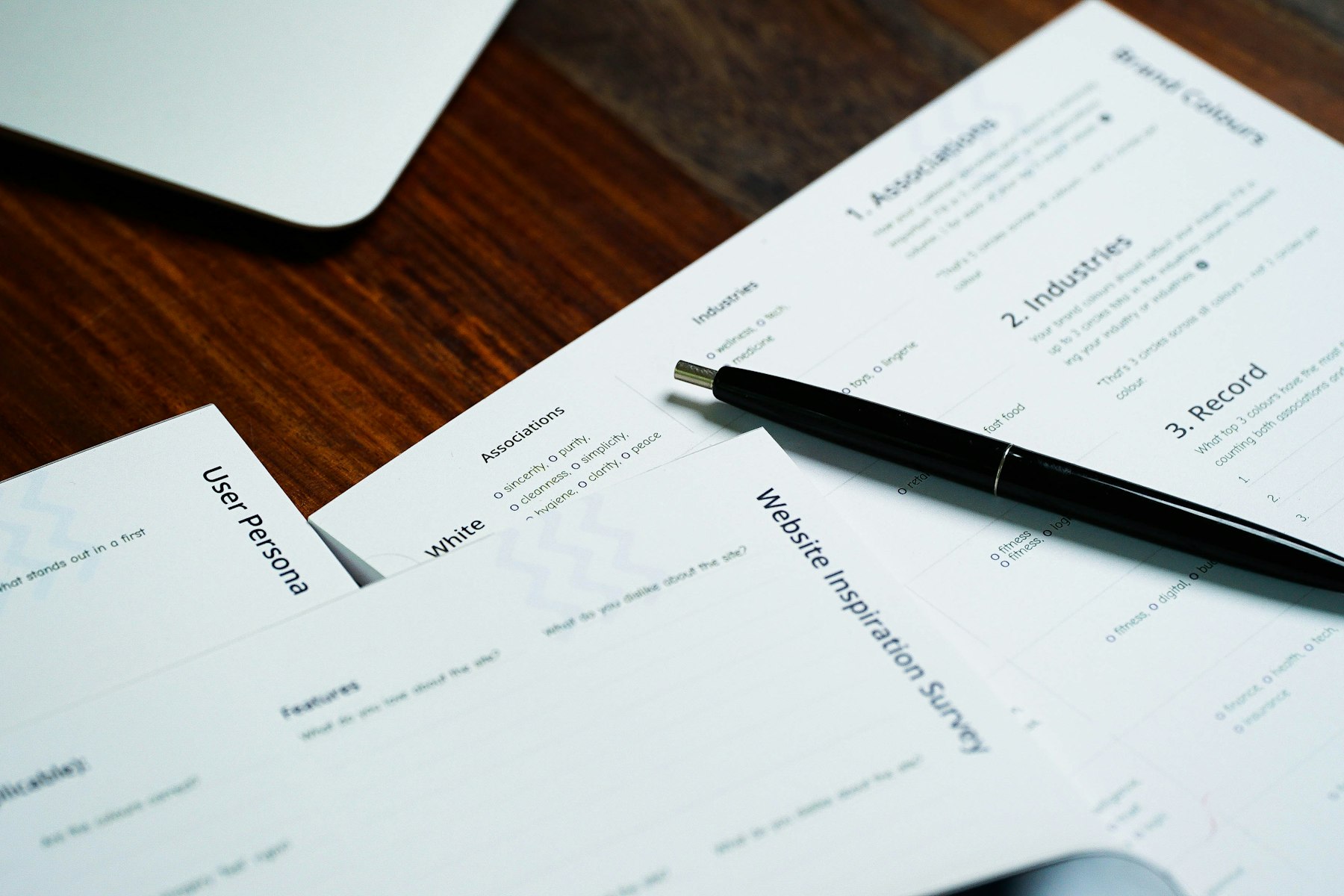 Pen resting on research paperwork